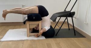 Gyaan lyon in supported Ardha Halasana